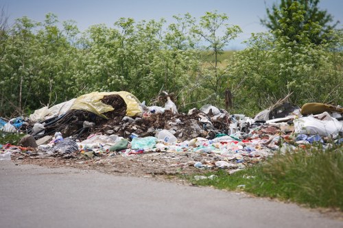 Crew carrying bulky waste from a terrace property near the seafront